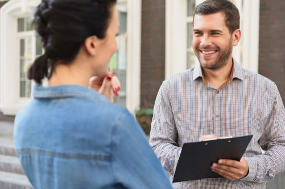 Smiling woman meeting with realtor Residential Pest Control Visit